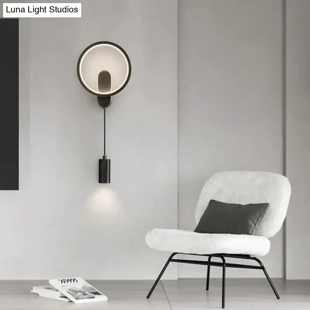 Modern nordic led wall lamp with black gold circular metal frame and adjustable downward-facing cylindrical light fixture