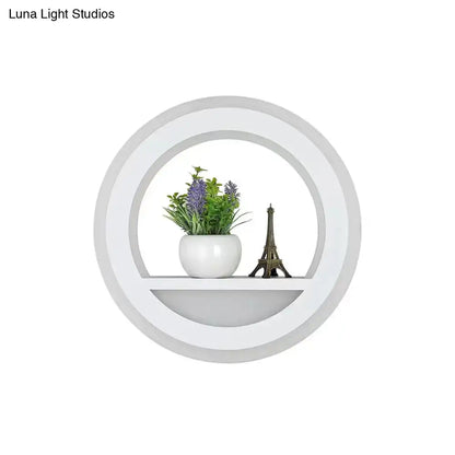 Modern nordic white wall light with circular shelf includes bulb and holds ceramic pot with purple flowers and eiffel tower