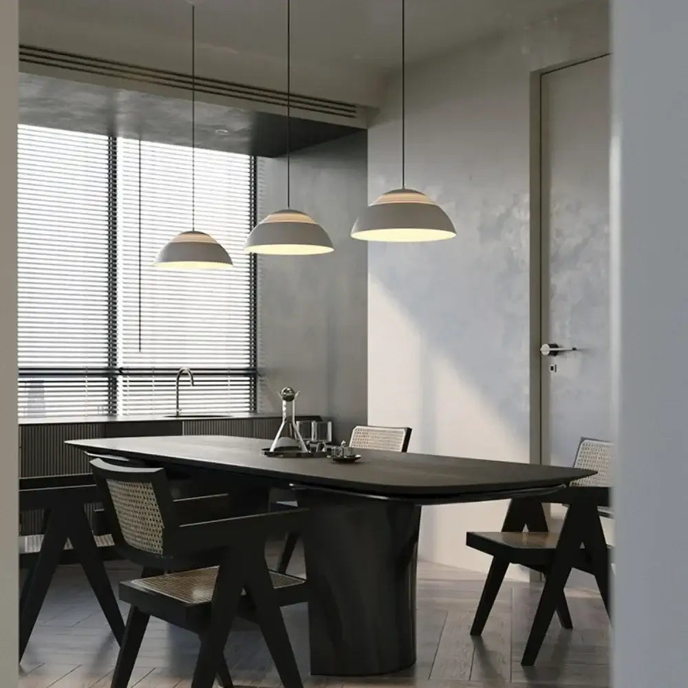 Three modern off white pendant lights with matte glass ball shades hang from ceiling for dining room decorbites glass ball pendant