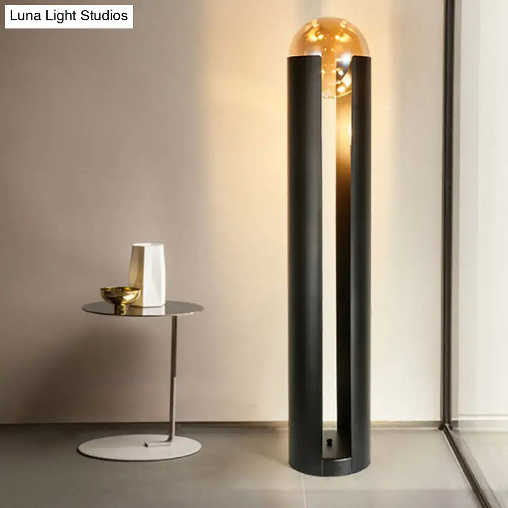 DecorBites modern black metal floor lamp with amber glass globe and linear capsule arch design 110v-120v