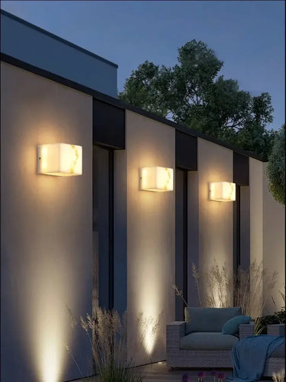 Modern onyx amber geometric led outdoor wall sconce featuring translucent alabaster-like material with warm glowing light for decorbites geometric led outdoor use
