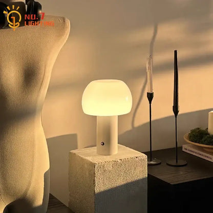 A sleek modern orange atmosphere mushroom table lamp with warm white glow and smooth matte finish for bedroom decor