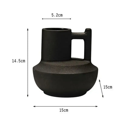 Modern orange geometric ceramic vase with a black matte ceramic vase handle and rounded base for decorbites decor