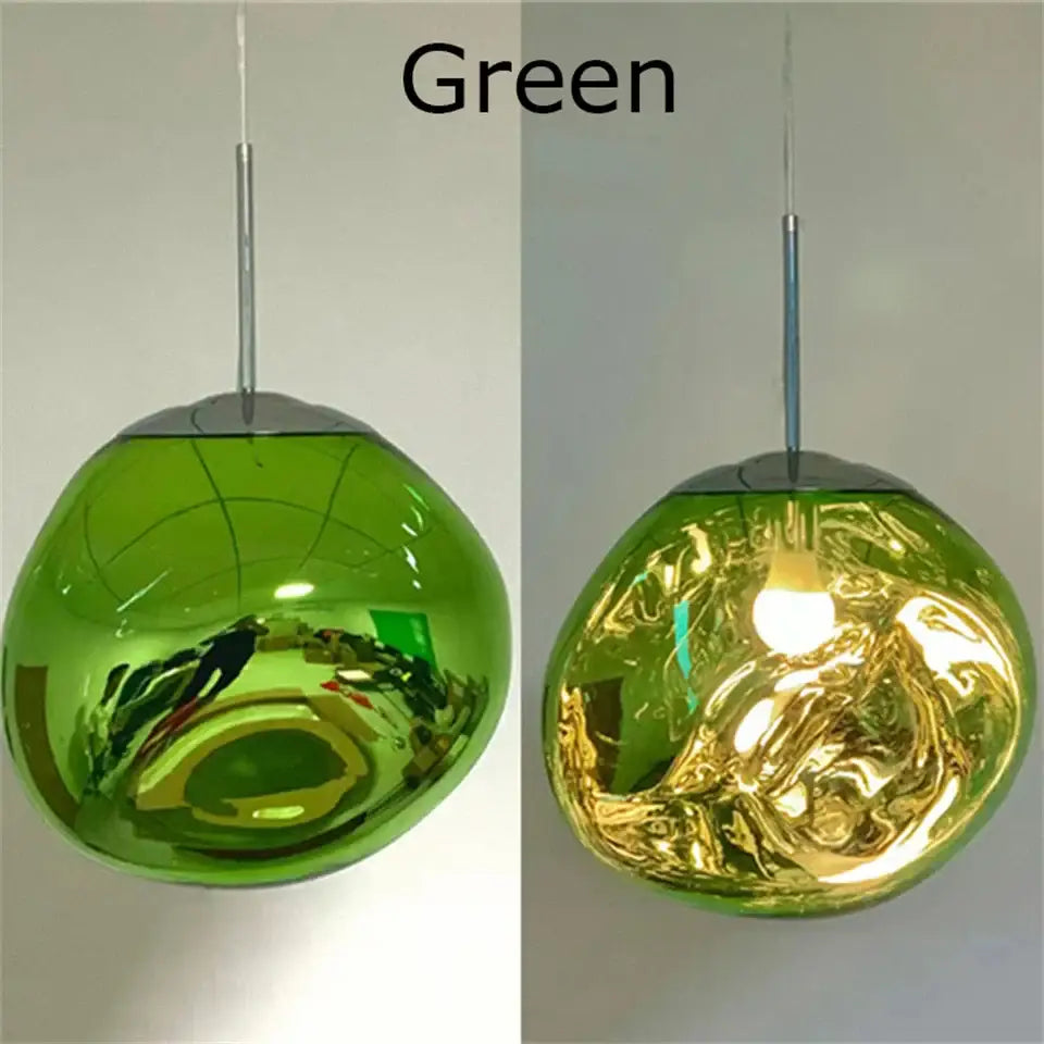 Green glass pendant light with organic form and chrome plated finish featuring a reflective spherical design