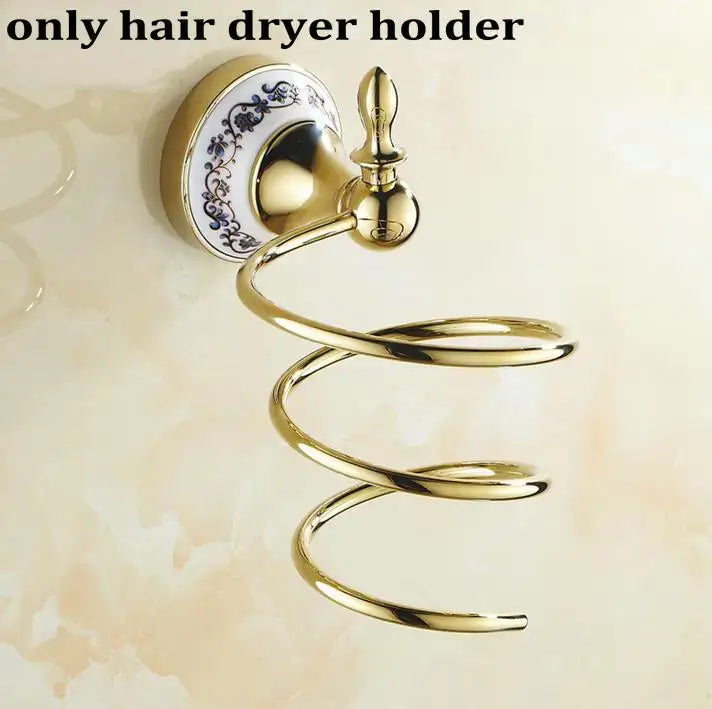 Modern ornate gold and white porcelain bath hardware set featuring a gold-toned spiral hair dryer holder with blue floral base