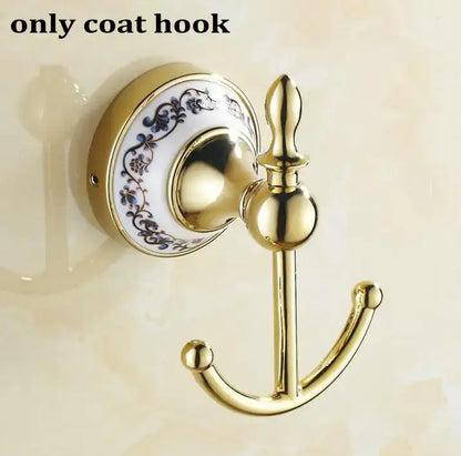 Modern ornate gold and white porcelain bath hardware set featuring a gold coat hook with blue floral ceramic backplate