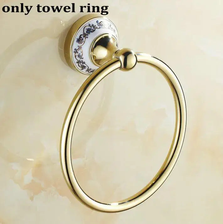 Modern ornate gold and white porcelain towel ring with blue floral ceramic backplate in bath hardware set