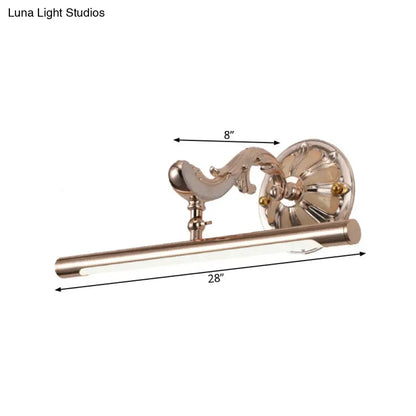 A sleek 28-inch polished brass wall mount bathroom lamp with ornate scrollwork and gold floral design