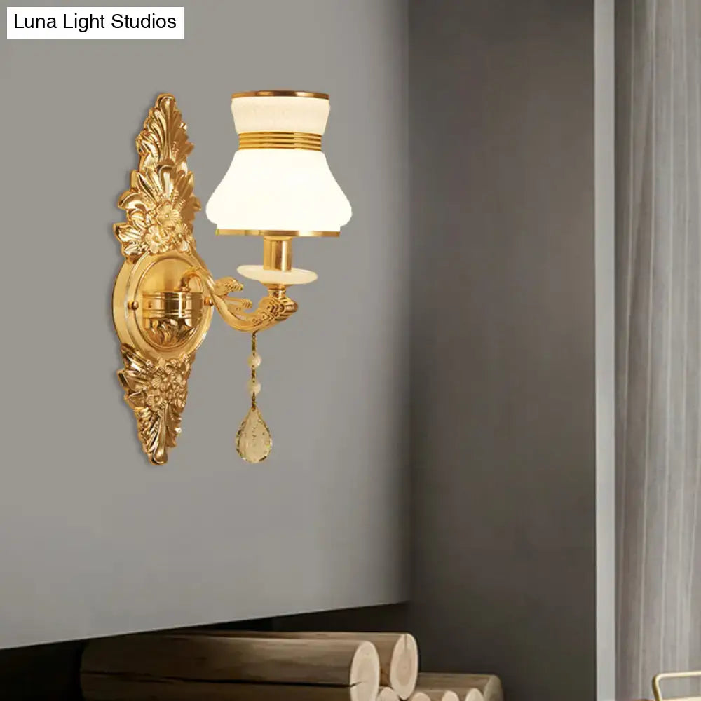 Modern ornate gold wall light with frosted glass shade and crystal teardrop pendant for bedroom sconce lighting