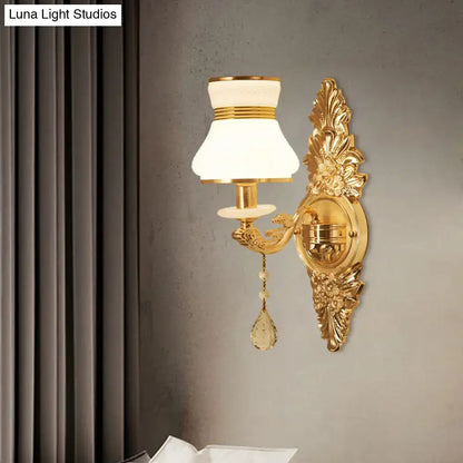 Modern ornate gold wall light with frosted glass shade and crystal teardrop for bedroom sconce lighting