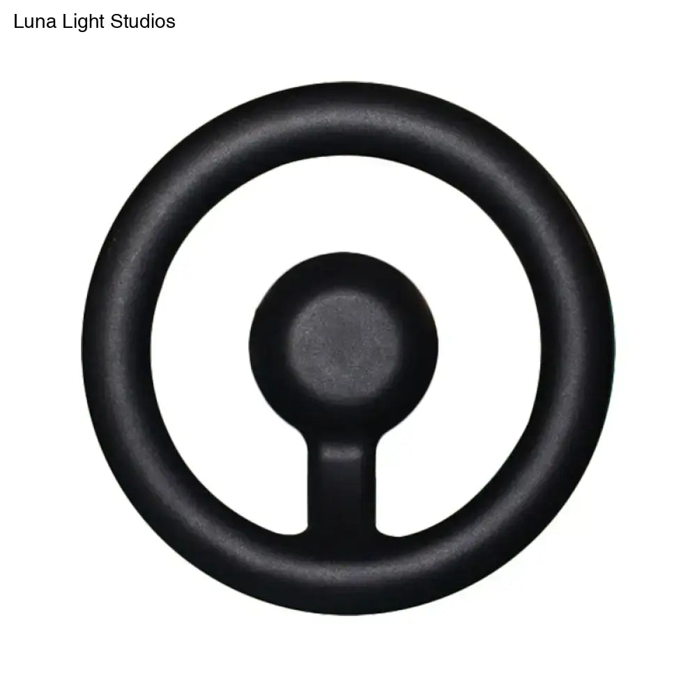 Black rubber steering wheel grip shown with modern oval black white led mirror bedroom wall light 110v-120v maximum bulb wattage