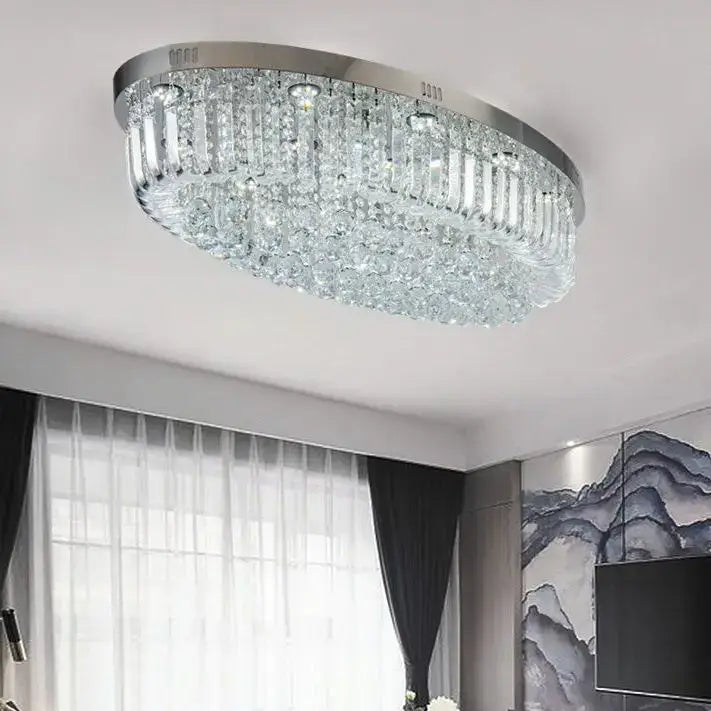 A modern oval chrome and gold crystal ceiling light with cascading prisms for dining room decorbites crystal dining