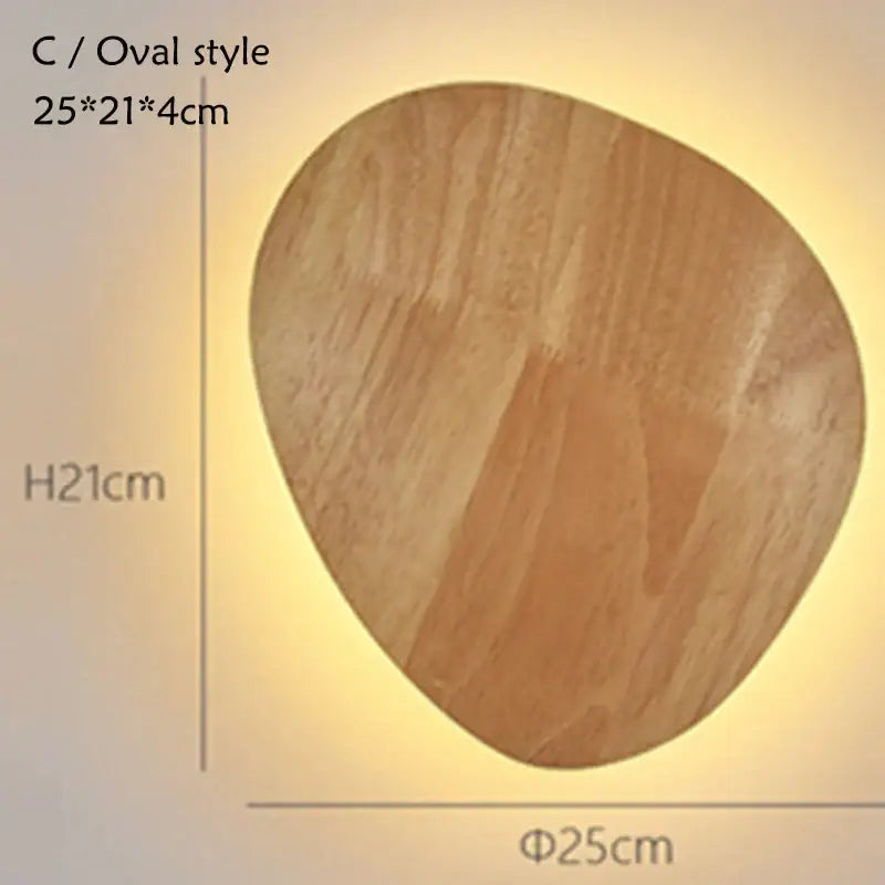 A warm-toned oval led wooden wall lamp with natural wood grain finish and smooth edges for bedroom decorbites led wooden