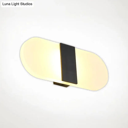 Modern oval rectangular convex led wall sconce with sleek elongated oval design and warm yellow diffused light for bedroom