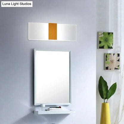Modern oval rectangular convex led wall sconce with a sleek white frame and central vertical orange accent panel