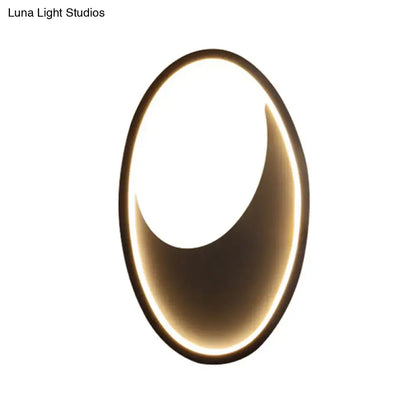 Modern oval white and black led wall lamp with gold-toned frame providing soft ambient lighting 110v-120v