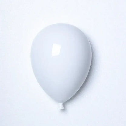 Modern pastel ceramic wall hanging decoration featuring a smooth matte white latex balloon for children room