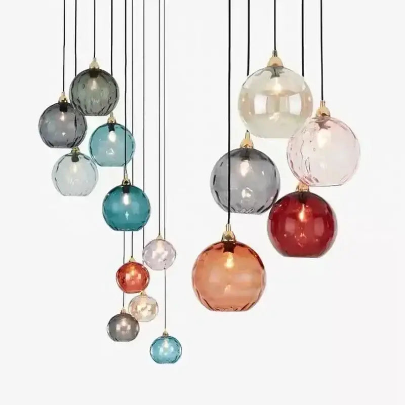 Modern pastel glass 7-globe pendant light with polished chrome finish featuring teal amber red and gray globes for dining rooms