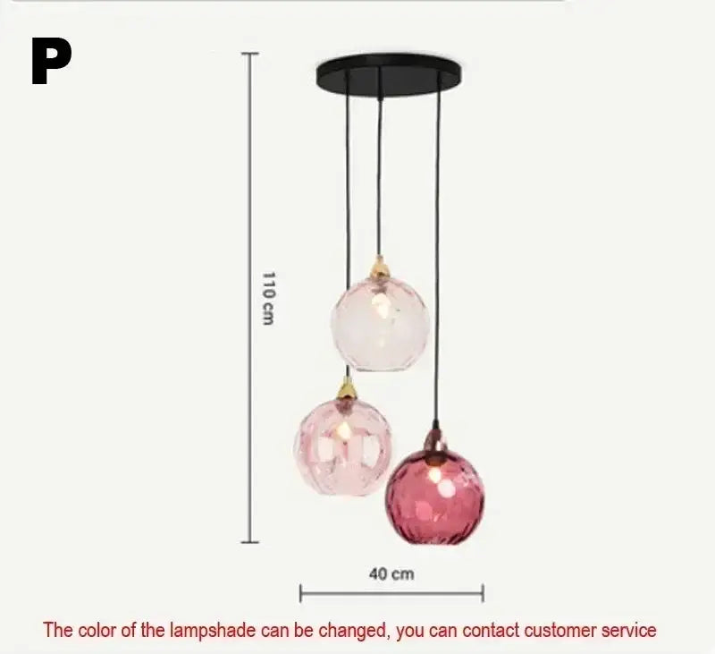 Modern pastel glass pendant light with seven pink spherical shades and polished chrome details for dining rooms under square meters