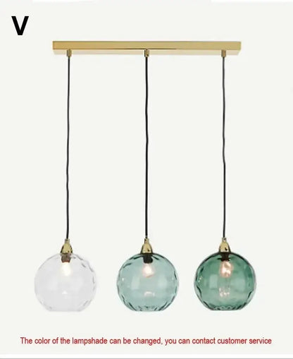 Modern pastel glass pendant light with brass bar, clear teal and green shades, polished chrome finish for dining room