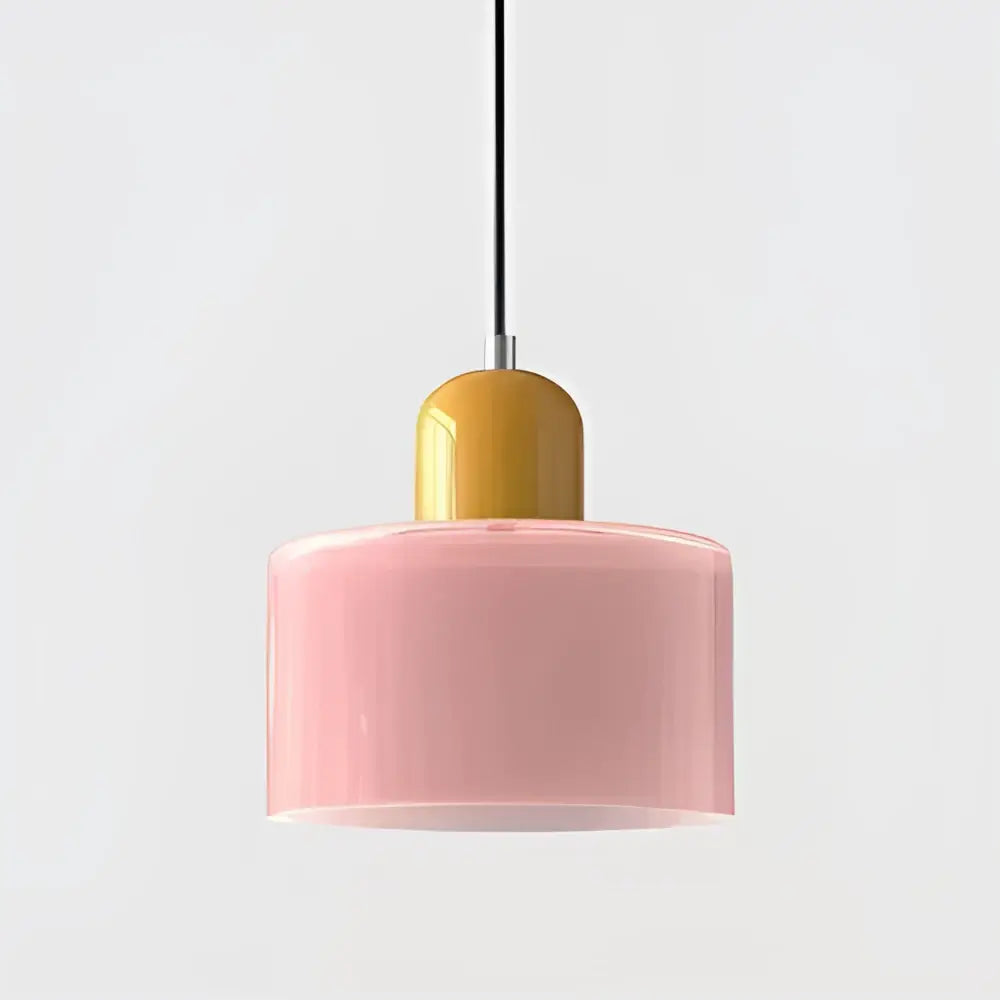 Modern pastel pink glass shade pendant light with matte yellow top cap and black cord for kitchen dining room use