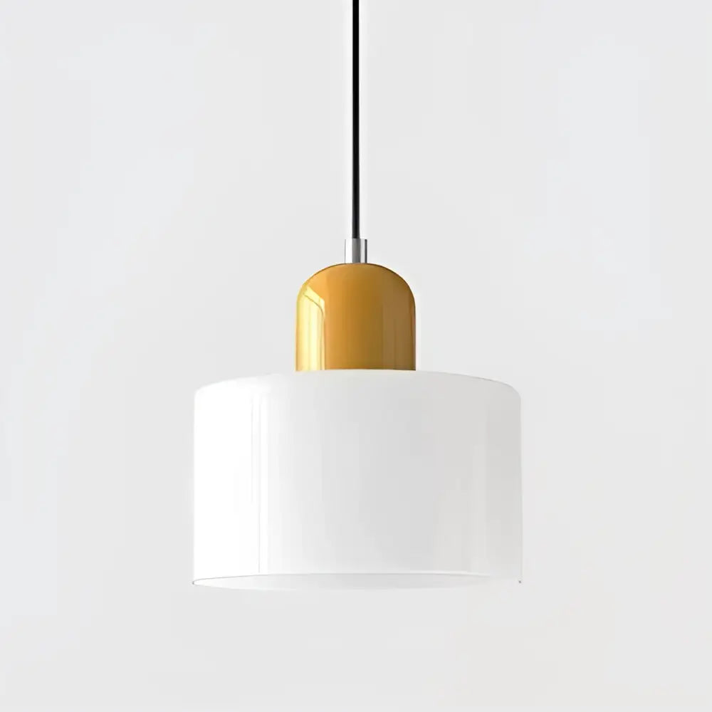 A modern pendant light with a sleek white glass shade and glossy amber top cap for kitchen or dining room use