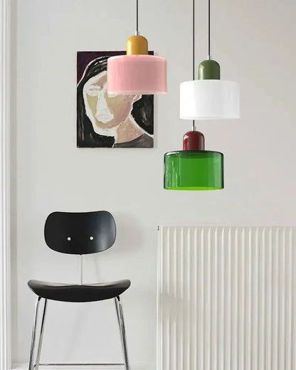 Three colorful pastel pendant lights with glossy stained glass shades for kitchen and dining room decor