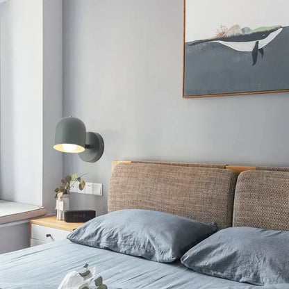 Modern matte gray iron wall light fixture with a rounded dome shade for bedroom wall light installation
