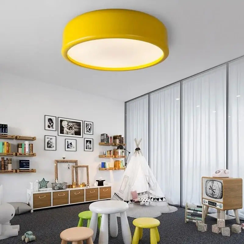 Bright yellow decorbites circular led ceiling light with smooth modern design for pastel pink and teal bedroom decor