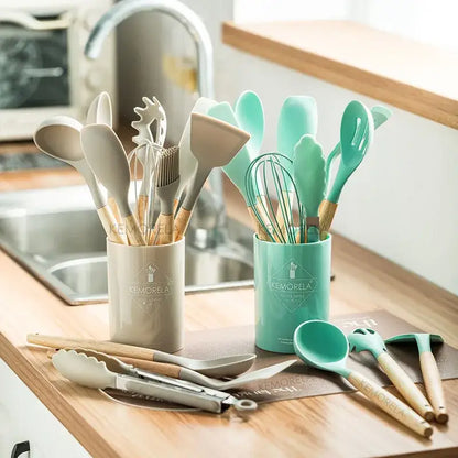 Modern pastel silicone kitchen utensil set with silicone-coated wooden handles in beige and mint green in kemorela containers