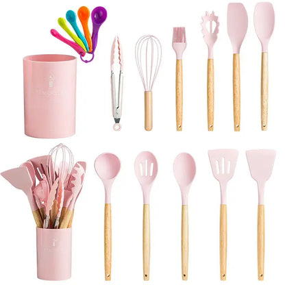 Modern pastel pink silicone kitchen utensil set with wooden handles and matching storage cup for kitchen use