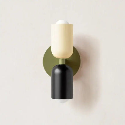 Modern peach and cream led wall light with matte olive backplate and sleek black cylinder by decorbites led wall