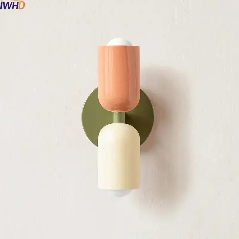 Modern peach and cream led wall lights with two-toned cylindrical design on olive green base by decorbites led wall
