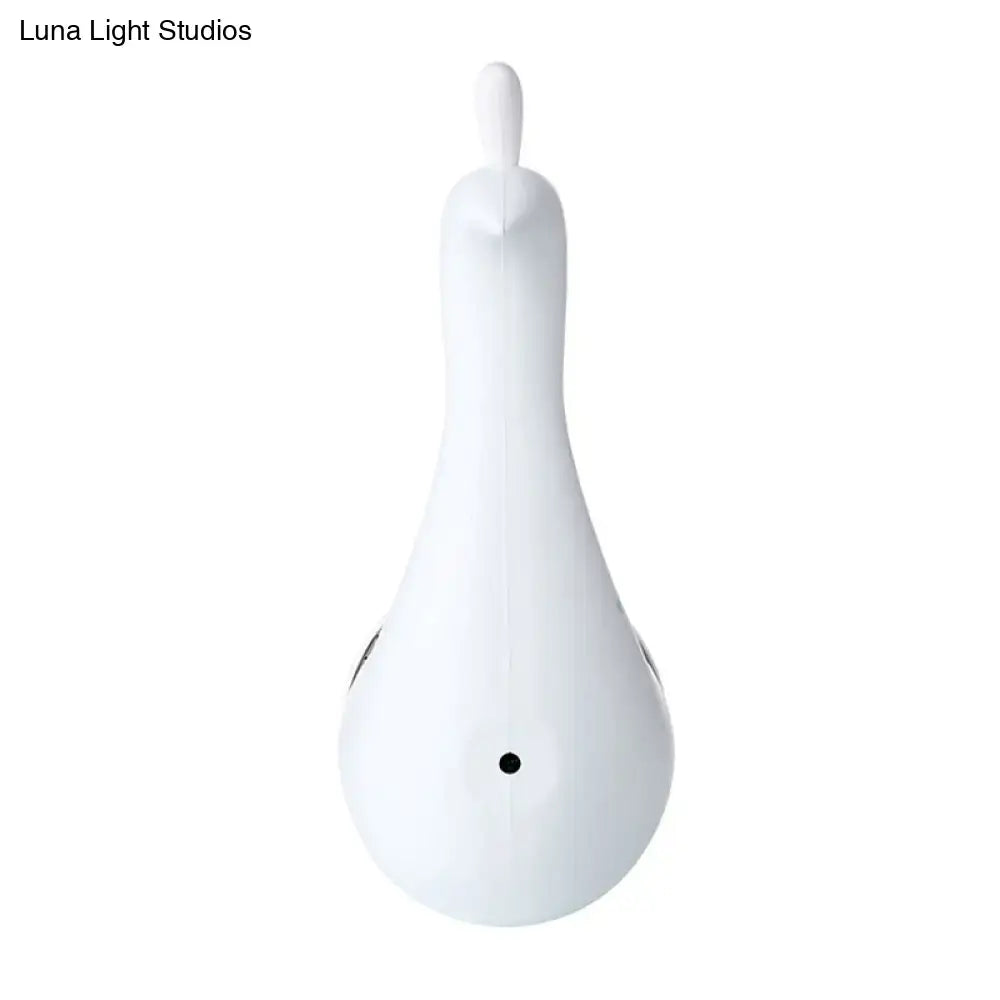 White ceramic duck-shaped massage tool with smooth glossy finish and black accents for modern peacock wall decor