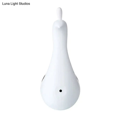 White ceramic duck-shaped massage tool with smooth glossy finish and black accents for modern peacock wall decor
