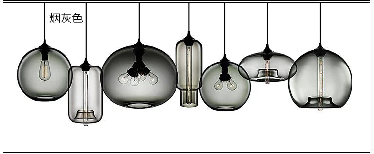 Set of modern pendant lights with smoked glass, vintage edison bulbs, and black metal fixtures for bedroom or dining room