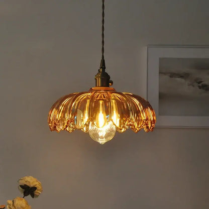 Modern petal amber glass led pendant lamp with brass fixture and twisted black cord for dining room lighting