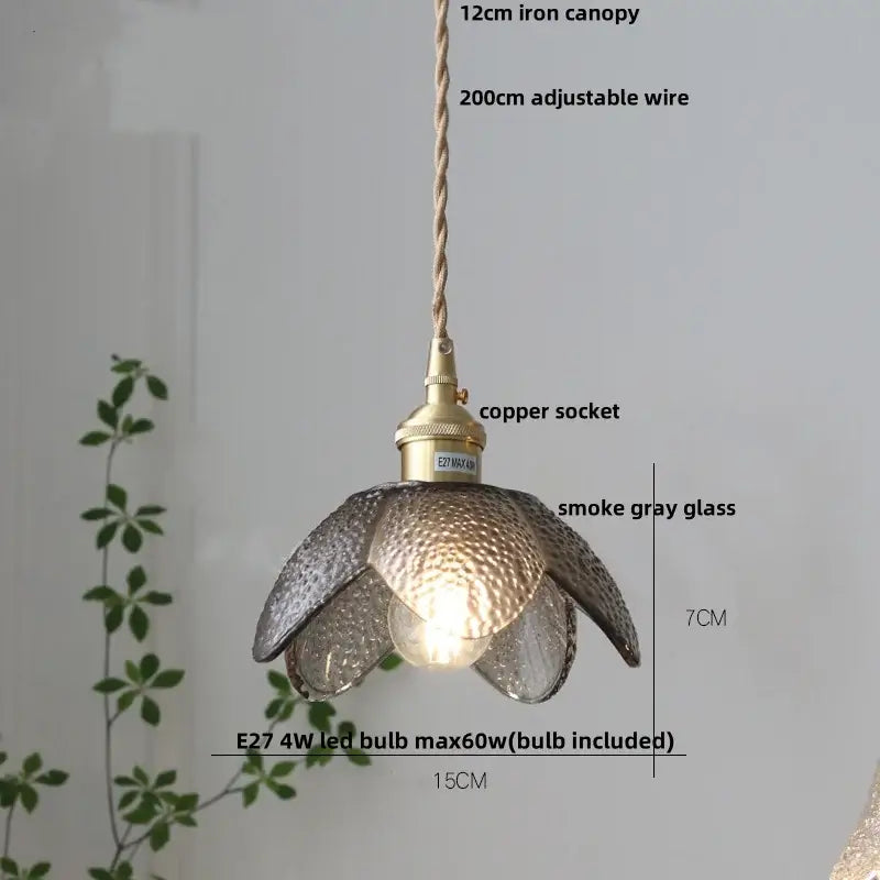Delicate flower-shaped pendant lamp with textured smoke gray decorbites clear glass petals and brass copper socket