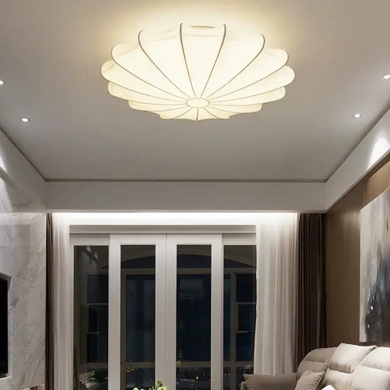 A modern cream silk led ceiling lamp with petal design and subtle metallic frame for living room decorbites cream silk