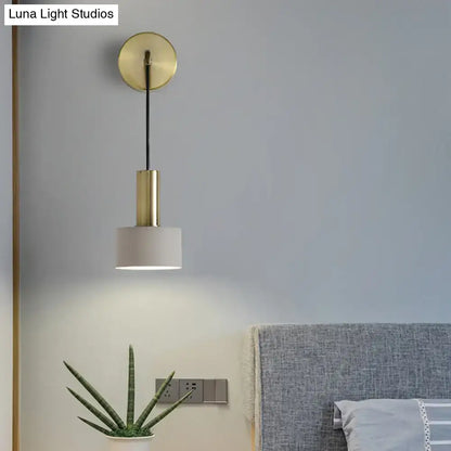 Modern pink and brass bedside reading wall sconce with brass finish cylindrical stem and white fabric shade e14 e26 e27
