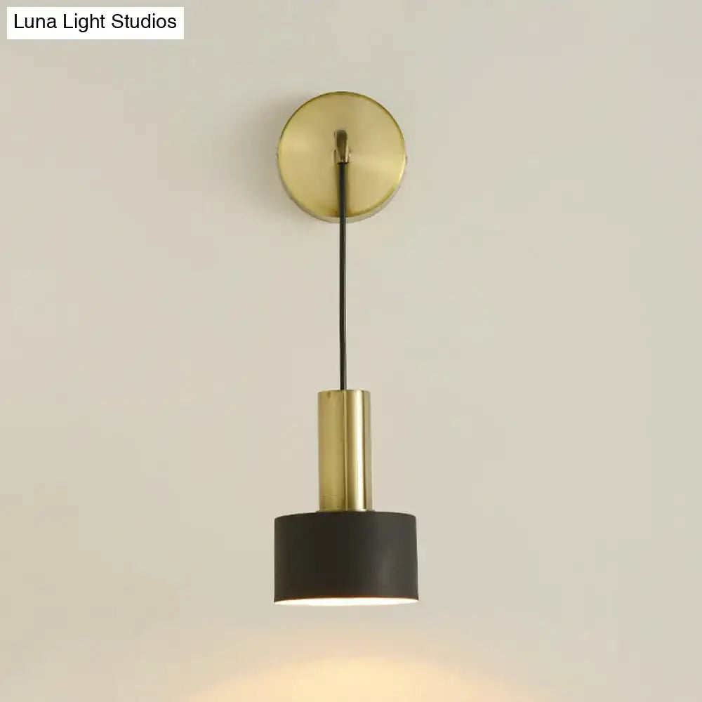 Brass-finished wall-mounted pendant light with matte black cylindrical shade for bedside reading e14 e26 e27 bulbs