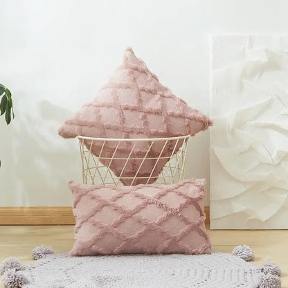 Modern pink and beige diamond embroidery cushion cover with soft blush pink textured fabric in a wire basket