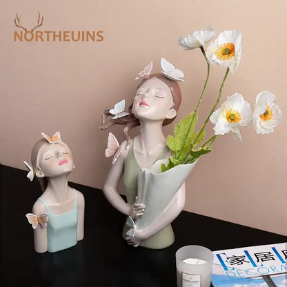 Modern pink butterfly girl resin figure featuring a delicate butterfly girl holding white poppies on a gold tray decor
