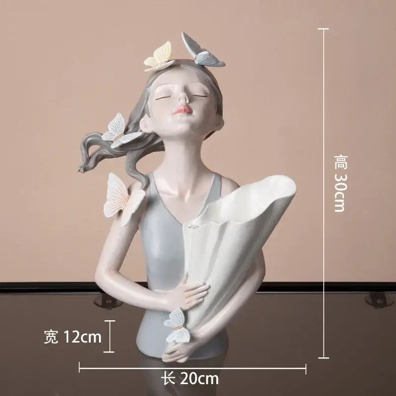 A serene light gray butterfly girl resin figure with flowing hair and white butterflies on gold tray for living room decor