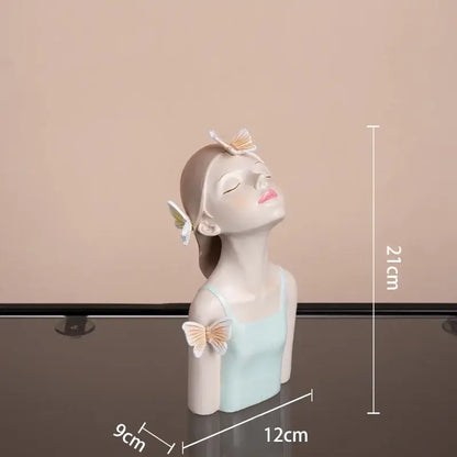 A matte-finish modern pink butterfly girl sculpture resin figurine with butterflies for living room decorbites decor