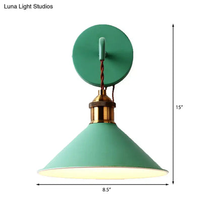 Modern pink conical metal wall sconce with teal industrial style brass base and twisted cord for gray pink yellow decor