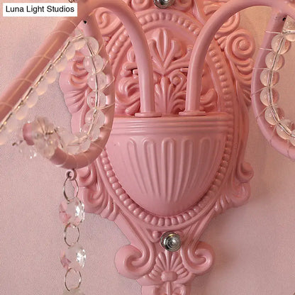 Modern pink wall lamp with metallic scroll arm and crystal beads decorative bedroom sconce lighting fixture