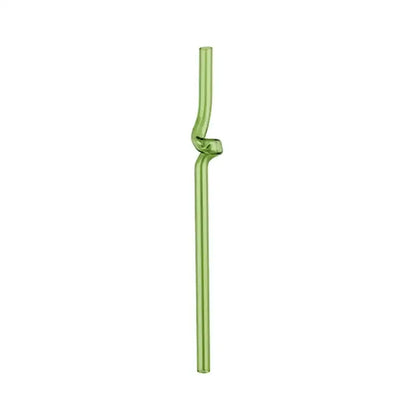 Translucent green glass straw with twisted knot design paired with modern pink and red glass mug set for dining room use