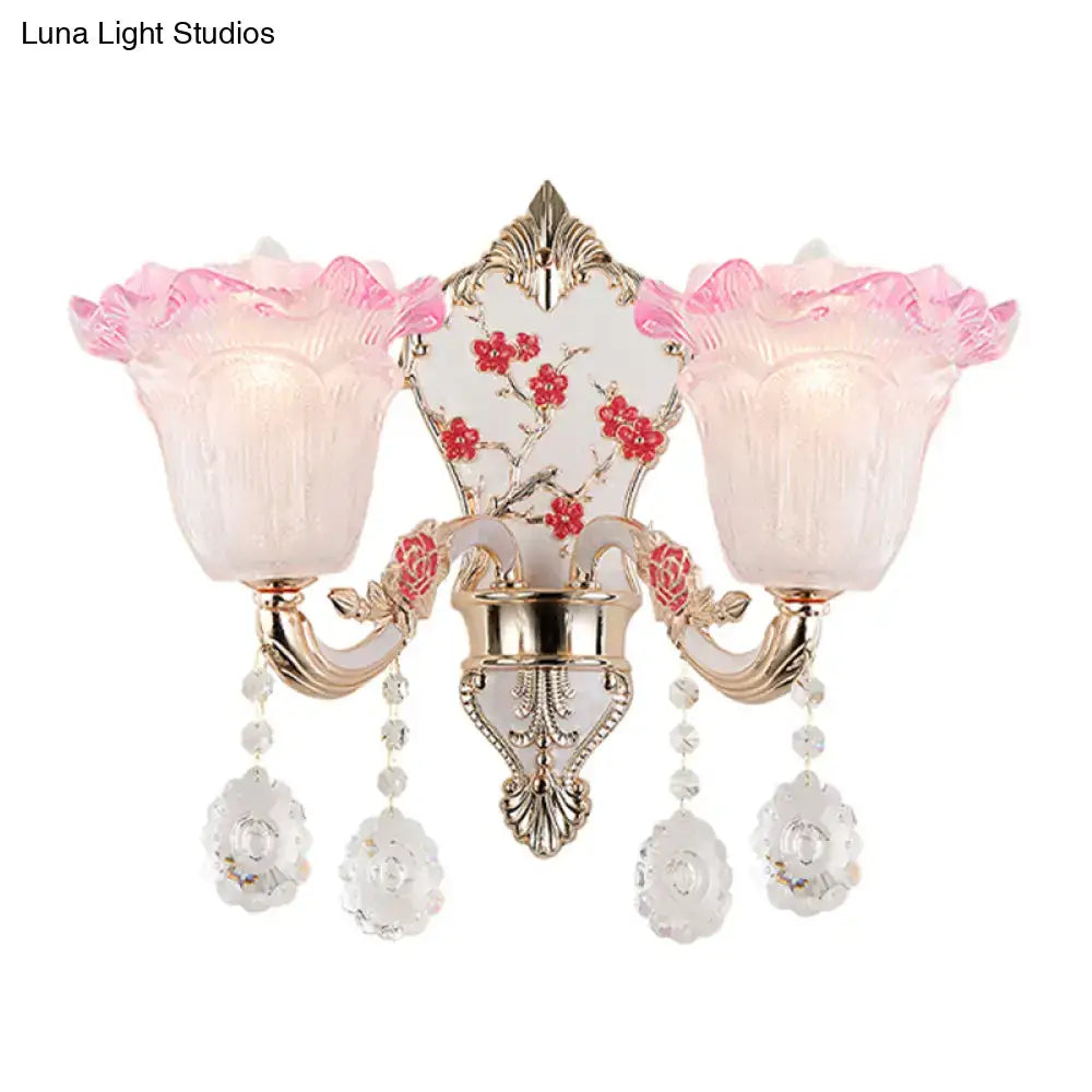 Elegant pink and white ruffle wall glass sconce lamp with gold metal accents and crystal pendants for bedroom lighting