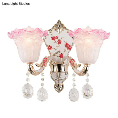Elegant pink and white ruffle wall glass sconce lamp with gold metal accents and crystal pendants for bedroom lighting